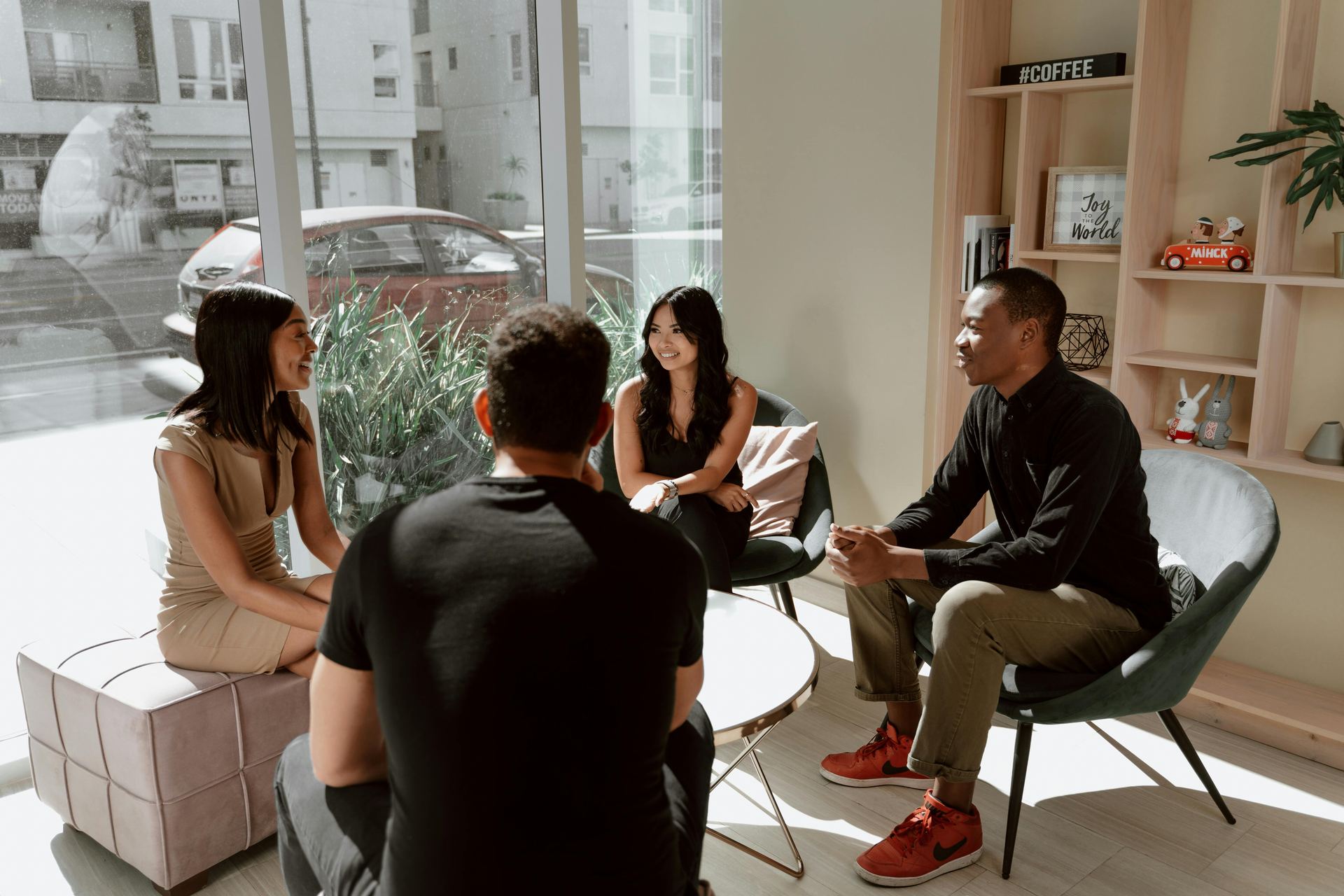 Group of academics having an informal discussion in a lounge