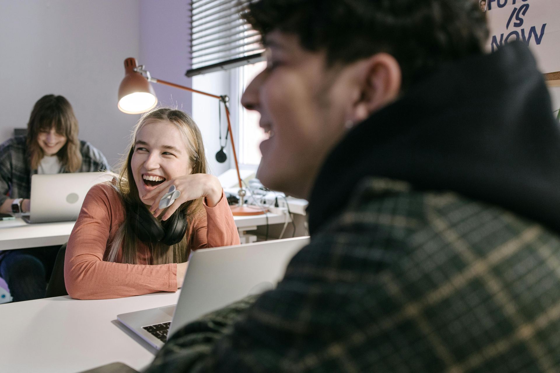 Students laughing together in a classroom